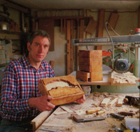 Peter Lloyd holding a box